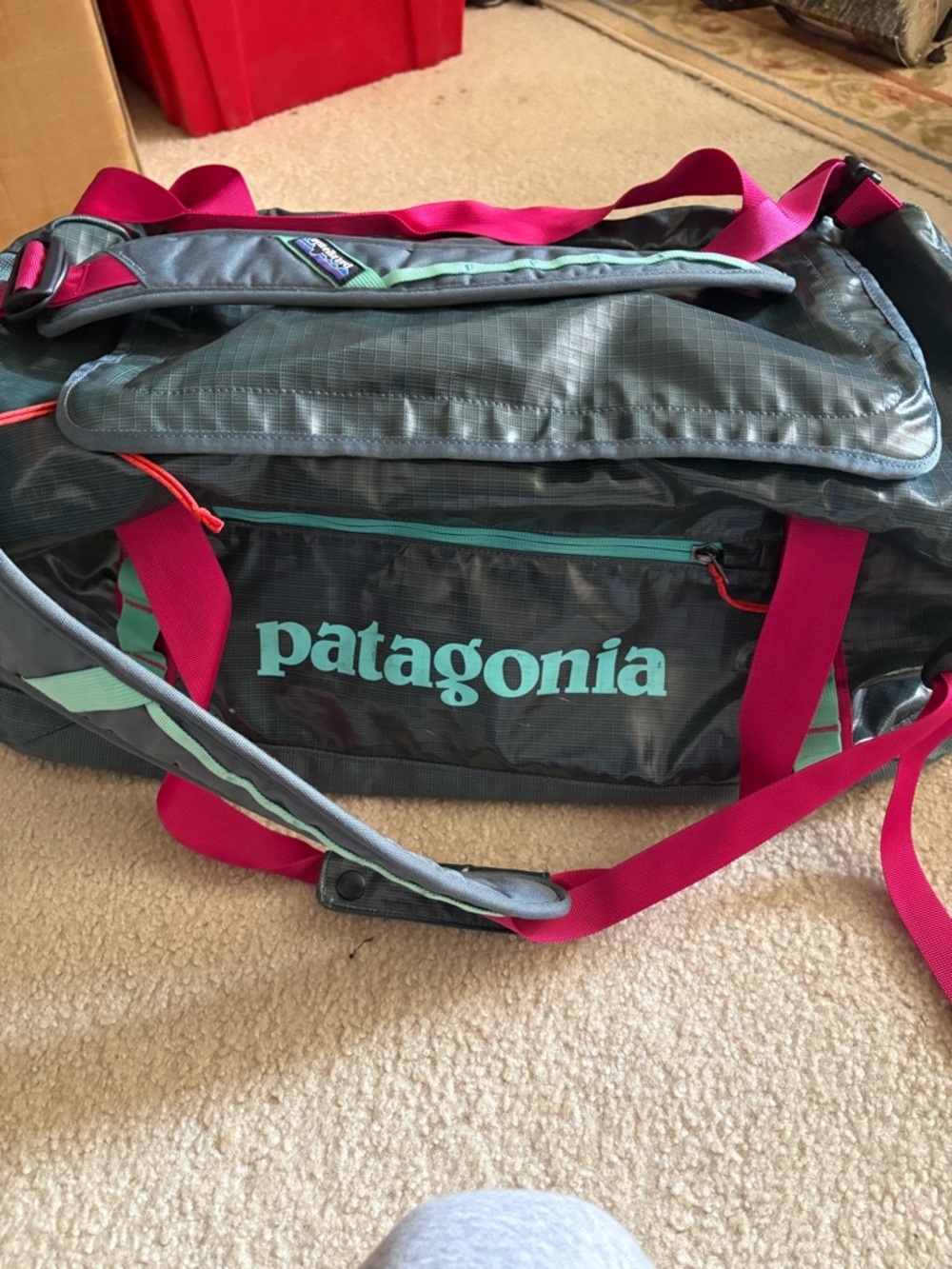 Patagonia Duffel with Teal Logo and Pink Straps  Black Hole 55L Duffel
Bag